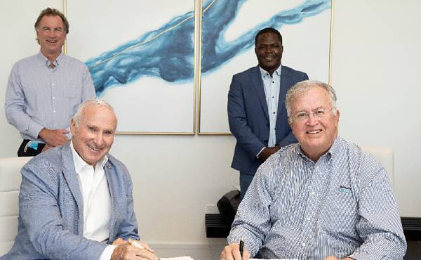 Signing the contract for the floating dock system, l to r: (standing) Stephen Tiller, CEO Sterling Global Financial; Khaalis Rolle, president Sterling Global Advisory Services; (seated) David Kosoy, executive chairman and founder Sterling Global Financial